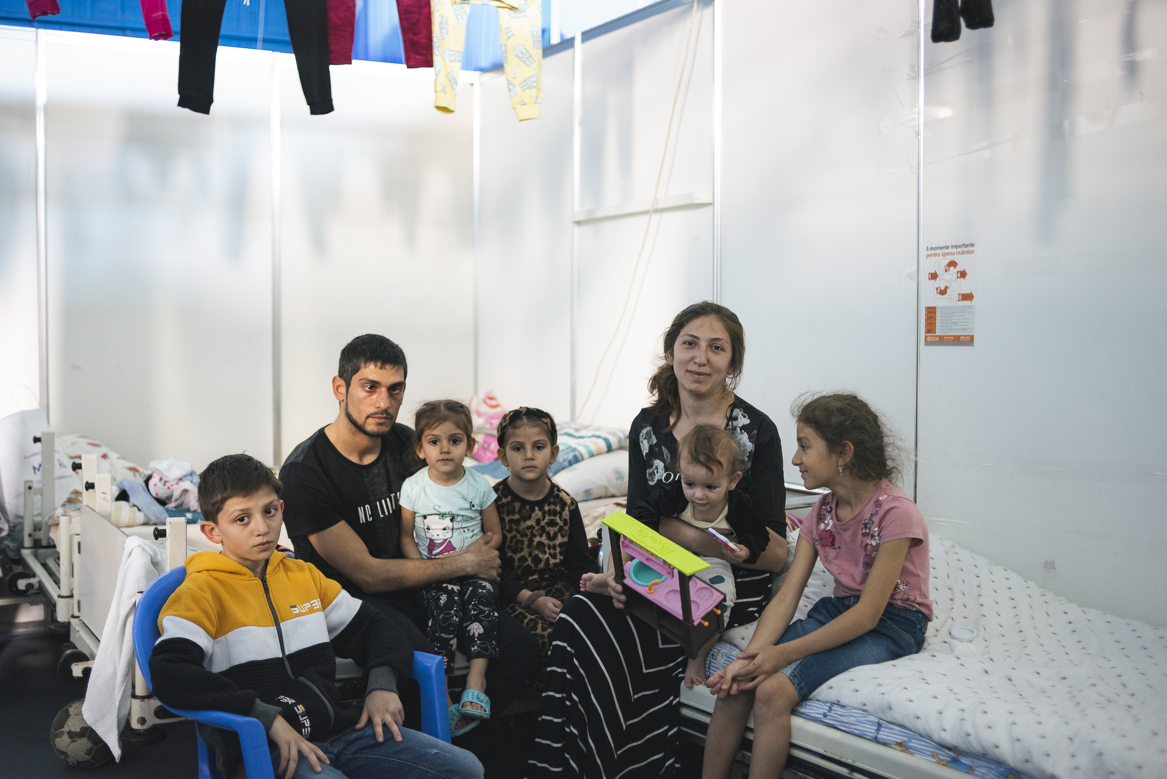 Tatiana, Artur and their family in their room at Moldexpo center.